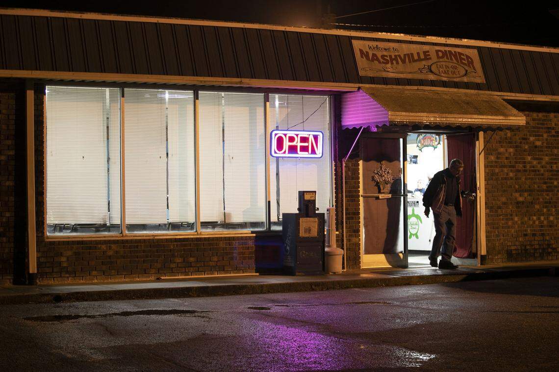 Fred Winstead leaves the Nashville Diner just after 6 a.m. with his breakfast biscuit on Thursday, March 19, 2020 in Nashville, N.C. The diner has closed their 76 seat dining room and has converted to a take-out only business due to the spread of the COVID-19 virus. Small businesses like the Nashville Diner are dependent upon their customer base to embrace take-out to keep their businesses open.