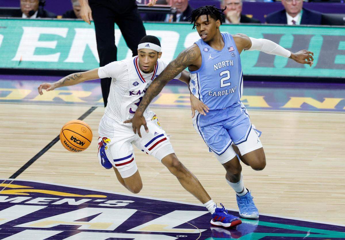 Kansas’ Dajuan Harris Jr. (3) steals the ball from North Carolina’s Caleb Love (2) during the second half of Kansas 72-69 victory over UNC in the NCAA Mens National Championship at the Caesars Superdome in New Orleans, La., Monday, April 4, 2022.