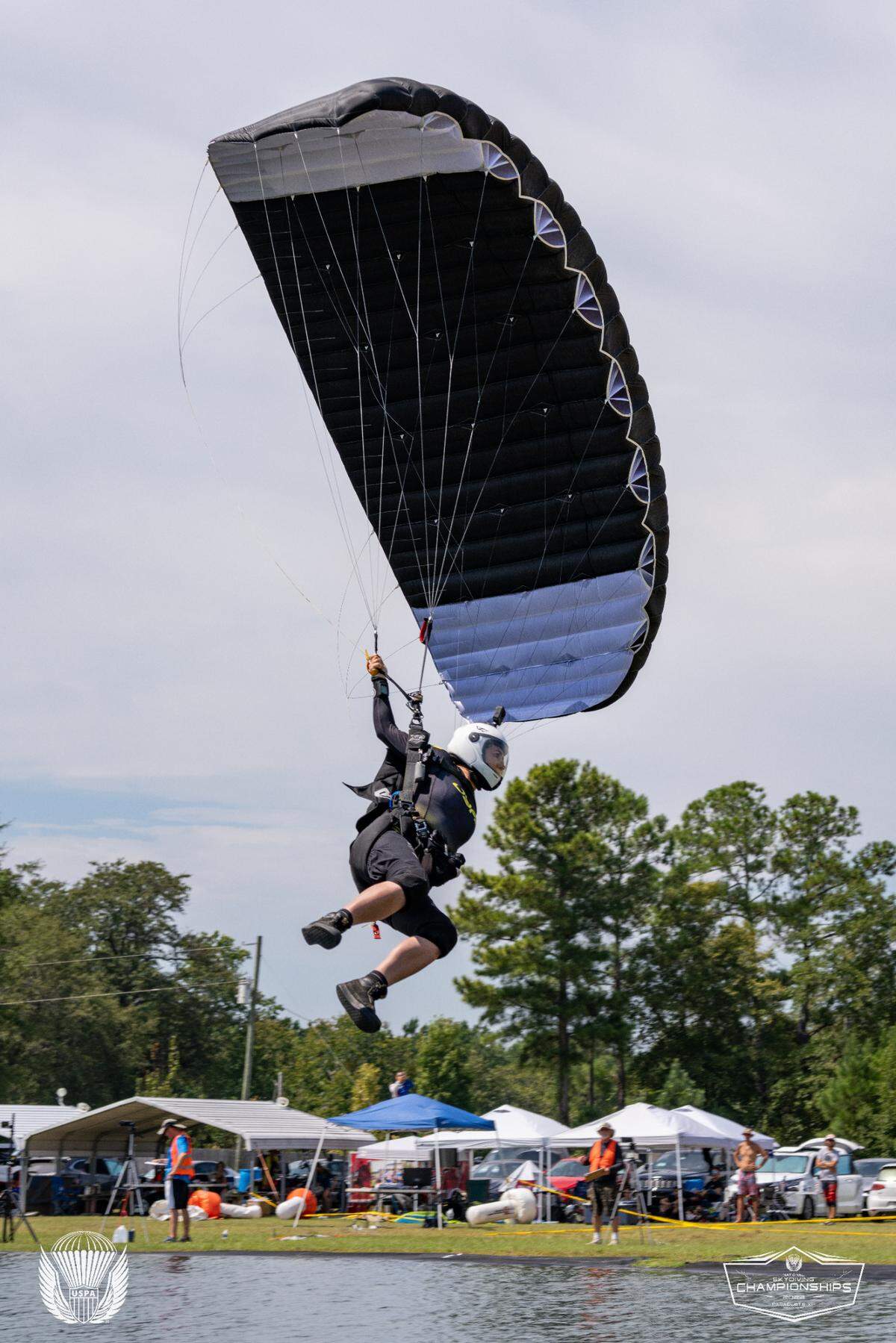 Robin Jandle lands across a “swoop pond,” which she uses at the end of a canopy competition, aiming for both speed and distance.