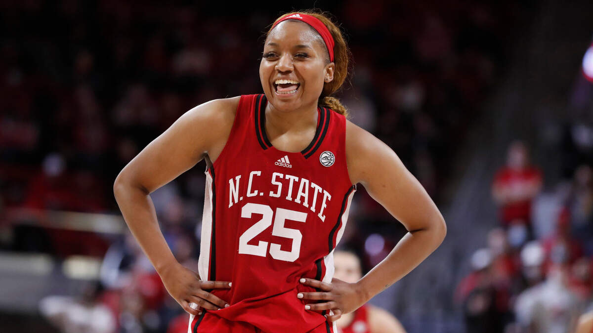 N.C. State’s Kayla Jones (25) laughs as she stands at the free throw line during the second half of N.C. State’s 95-53 victory over Syracuse at Reynolds Coliseum in Raleigh, N.C., Sunday, Feb. 20, 2022.