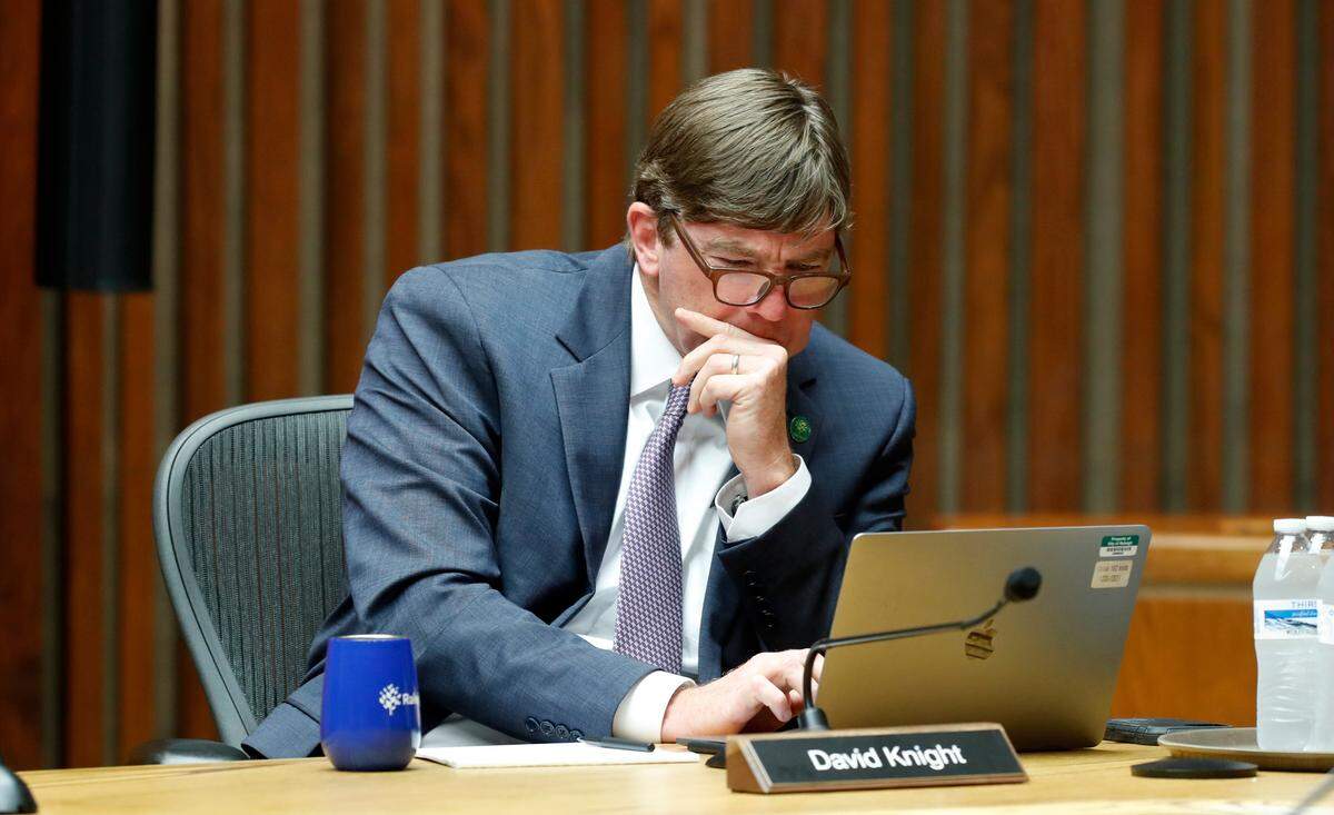 Raleigh city council member David Knight looks up information during the Raleigh City Council meeting at the Municipal Building in Raleigh, N.C. Tuesday, June 15, 2021.