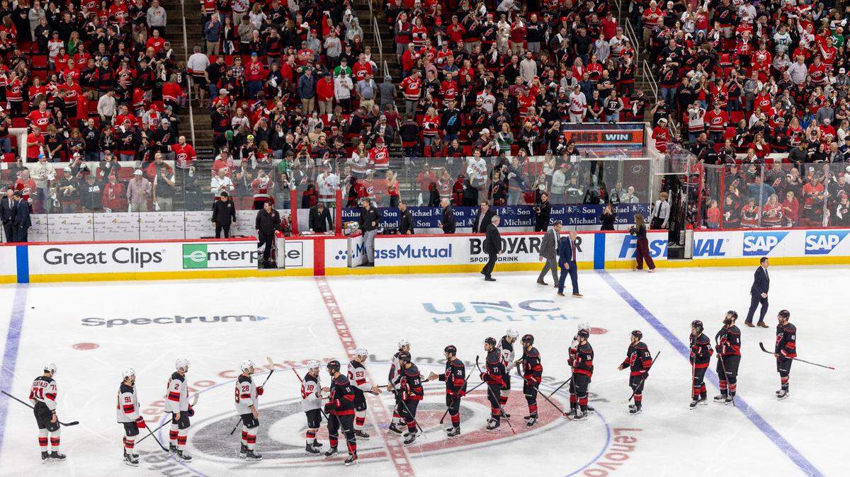The Carolina Hurricanes and the New Jersey Devils go through the handshake line after the Hurricanes 5-4 double overtime victory on Tuesday, April 29, 2025 at Lenovo Center in Raleigh, N.C.