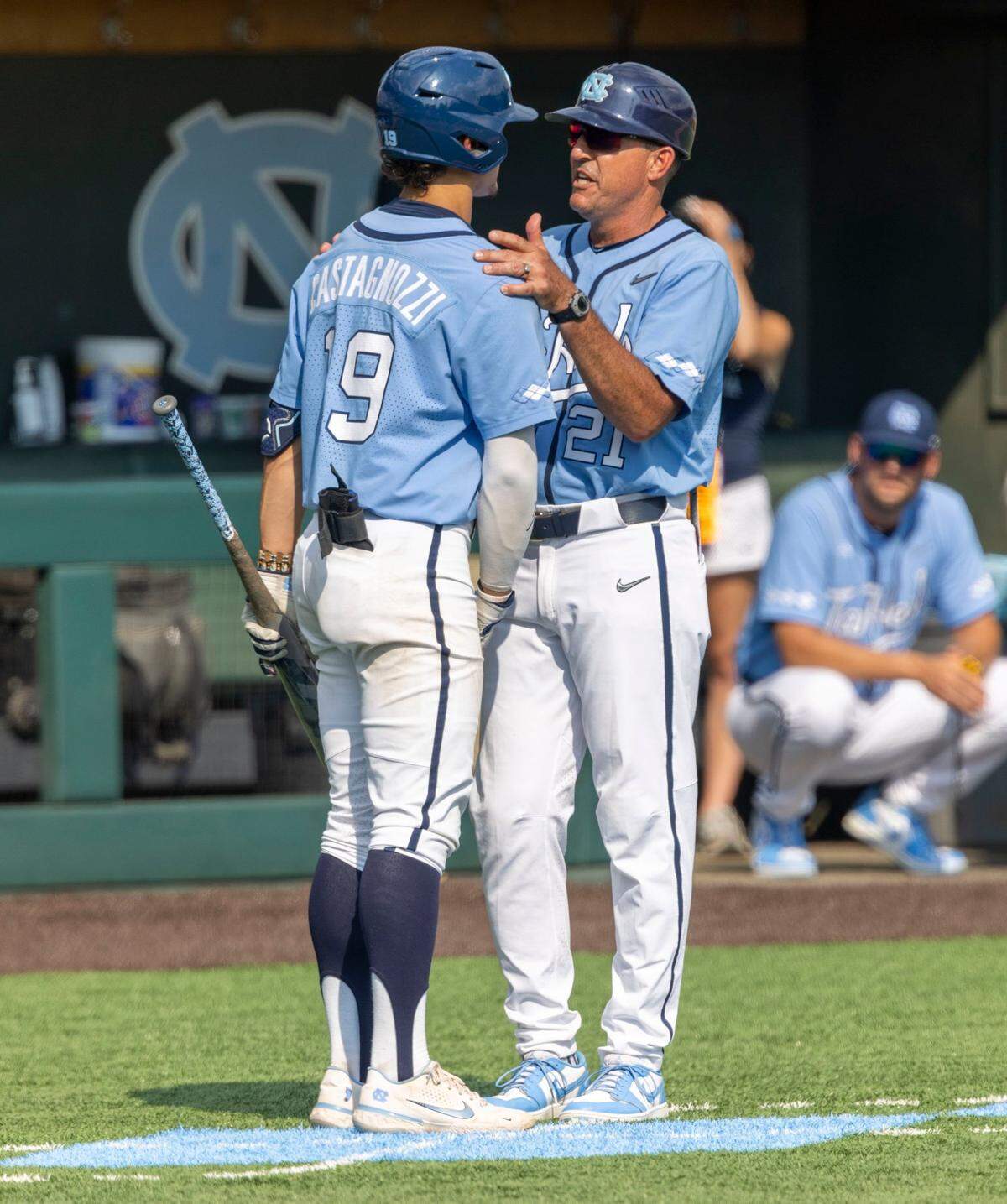 North Carolina coach Scott Forbes has a word with Johnny Castagnozzi (19) before his at bat in the seventh inning against Arkansas in game two of their NCAA Super Regional series on Sunday, June 12, 2022 at Boshamer Stadium in Chapel Hill, N.C.