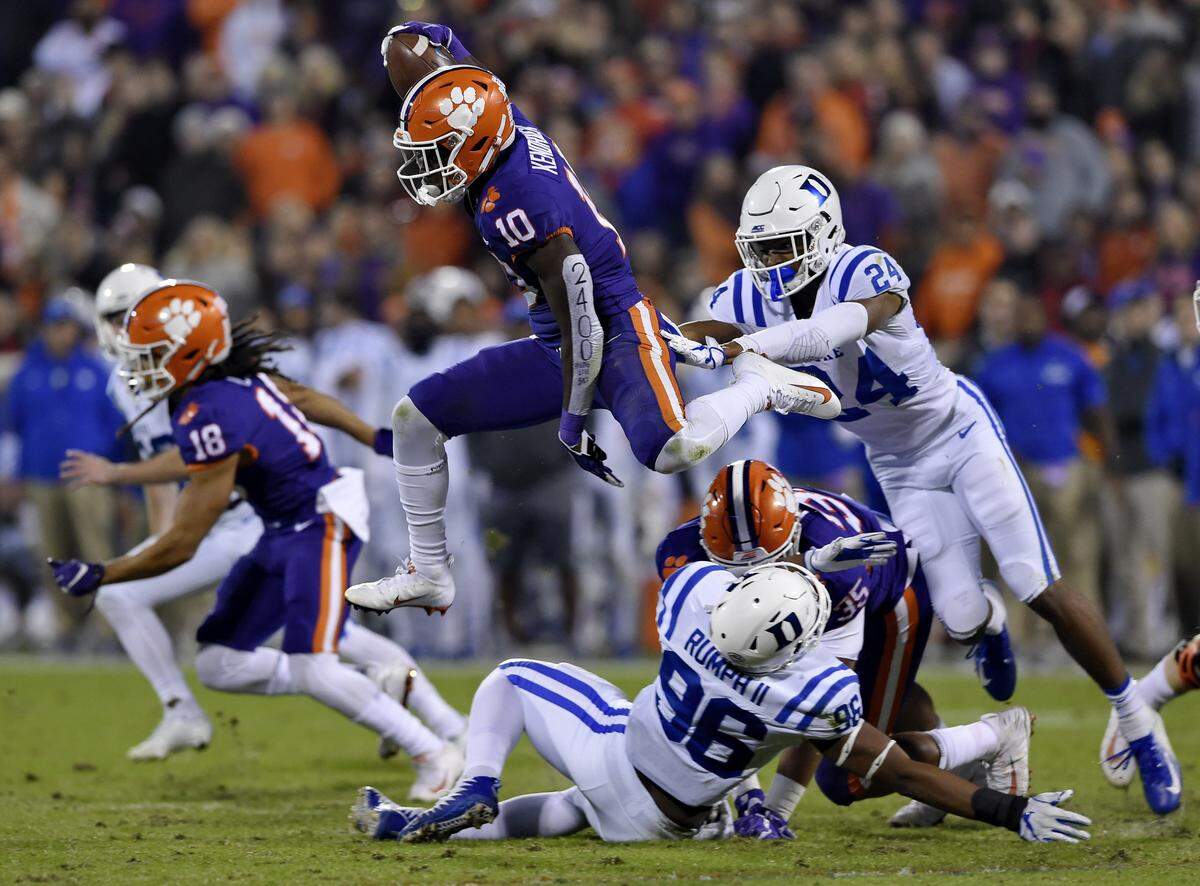 Clemson’s Derion Kendrick (10) hurdles Duke’s Chris Rumph ll (96) on a kickoff return as Jarrett Garner reaches for him during the first half Saturday, Nov. 17, 2018, in Clemson, S.C. 