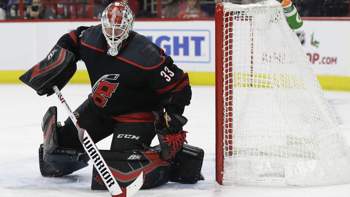 Carolina Hurricanes goalie Scott Darling (33) defends the goal during the first period of an NHL hockey game in Raleigh, N.C., Friday, Dec. 14, 2018. (AP Photo/Gerry Broome)