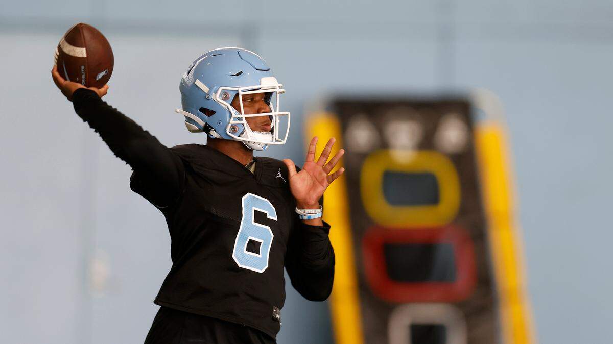 North Carolina quarterback Jacolby Criswell throws a pass during UNC’s first football practice of the season on Friday, July 29, 2022, in Chapel Hill, N.C.