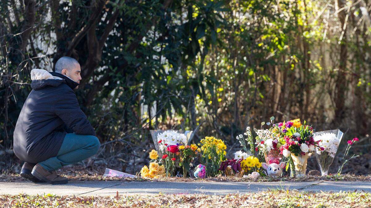A mourner visits a makeshift memorial Wednesday, Jan. 3, 2023 in front of the Cary home of 6- year-old Joselin Perez Hernandez, who was killed Friday after being hit by a car, Cary police said.