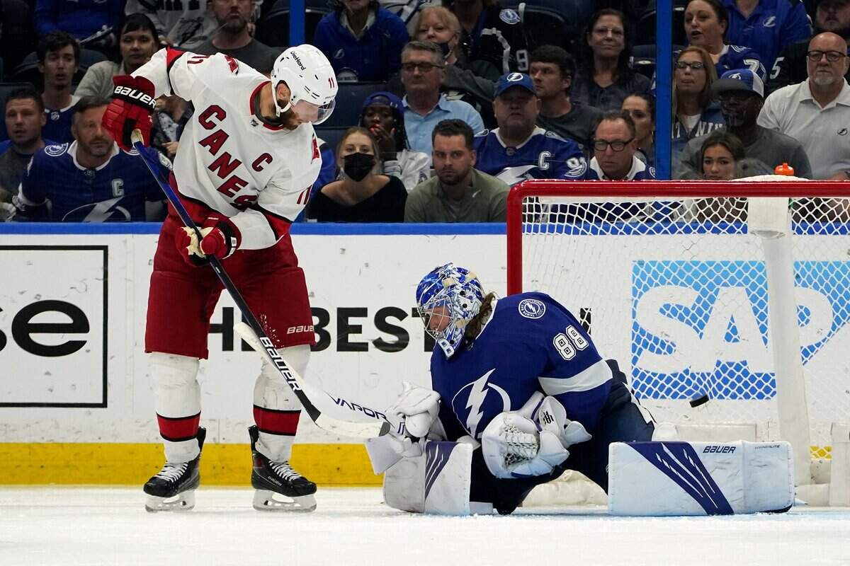 Carolina Hurricanes center Jordan Staal (11) watches the game-winning shot get past Tampa Bay Lightning goaltender Andrei Vasilevskiy (88) for a goal during overtime in Game 3 of an NHL hockey Stanley Cup second-round playoff series Thursday, June 3, 2021, in Tampa.