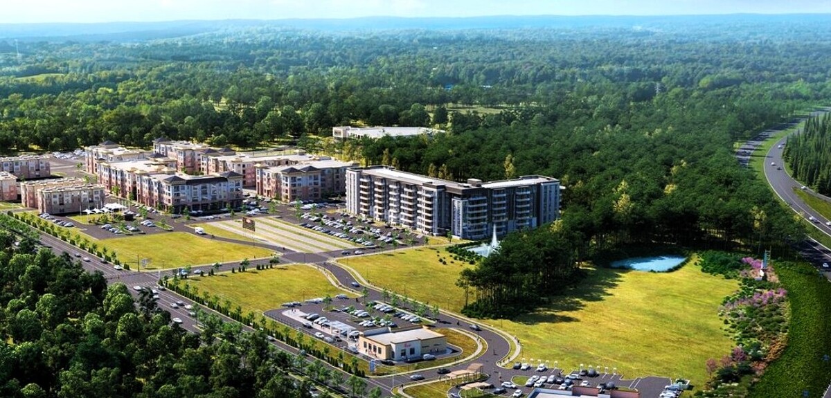 Carraway Village, a 55-acre mixed-use community, continues to grow between Interstate 40 and Eubanks Road in northern Chapel Hill. The green fields in the foreground could become commercial projects and a central social district in the near future.
