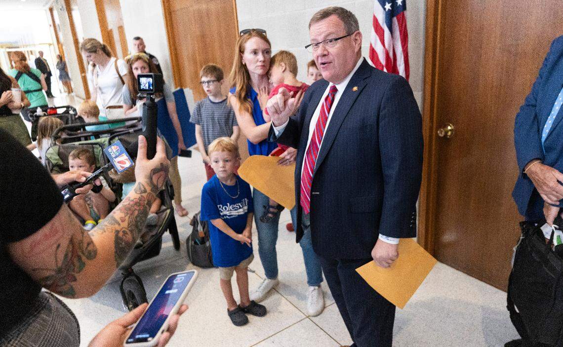 House Speaker Tim Moore accepts a letter on Wednesday, July 31, 2024 signed by N.C. parents urging Republican lawmakers to keep their promise to fully fund private school vouchers for 55,000 students on a state waitlist. Critics of the voucher expansion say lawmakers should prioritize public schools.