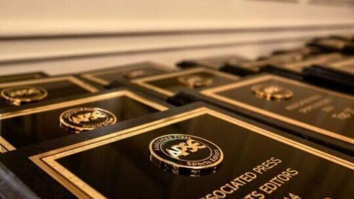 Associated Press Sports Editors award plaques are laid out on a table before a recent convention.