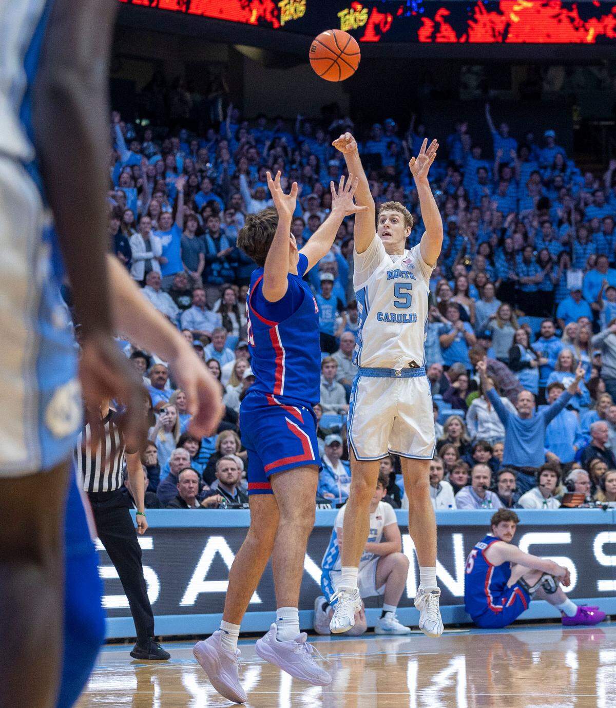 North Carolina forward Cade Tyson (5) launches a three-point shot over American University forward Julen Iturbe (32) in the second half on Friday, November 15, 2024 at the Smith Center in Chapel Hill, N.C. Tyson scored 11 points in the Tar Heels’ victory.