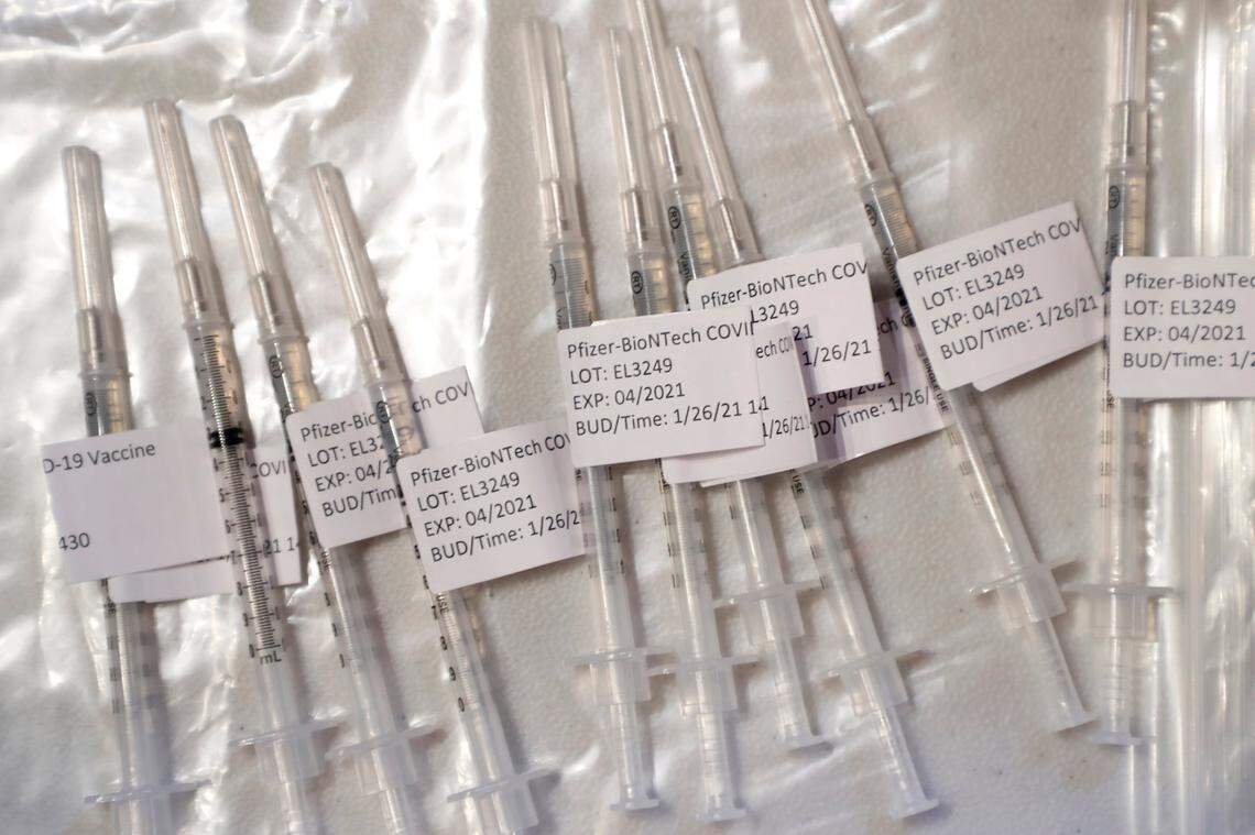 COVID-19 vaccination shots sit ready during a COVID-19 vaccination clinic administered by FirstHealth of the Carolinas at the Fair Barn in Pinehurst, N.C., Tuesday, January 26, 2021.