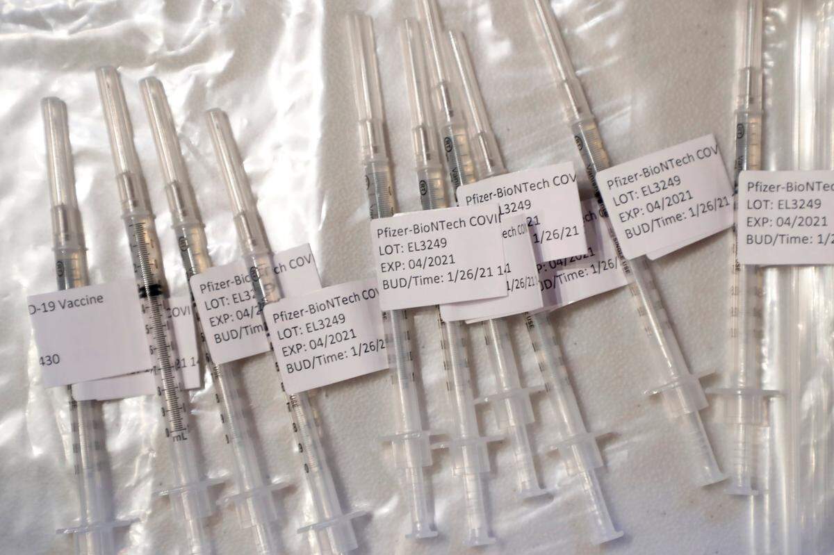 COVID-19 vaccination shots sit ready during a COVID-19 vaccination clinic administered by FirstHealth of the Carolinas at the Fair Barn in Pinehurst, N.C., Tuesday, January 26, 2021.