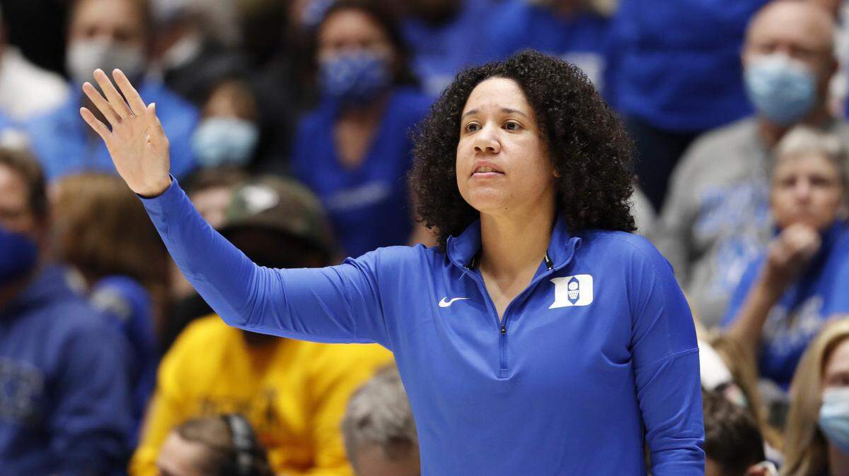 Duke women’s basketball coach Kara Lawson works the sideline during the Blue Devils’ game against South Carolina, Dec. 16, 2021.