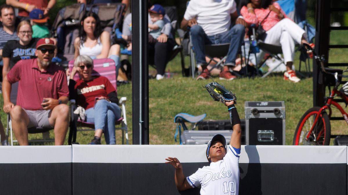 Duke’s D’Auna Jennings makes a catch at the outfield wall during the fifth inning of the Blue Devils’ 6-3 win over Florida State in the ACC Tournament final on Saturday, May 11, 2024, in Durham, N.C.