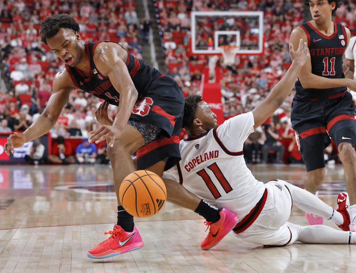 N.C. State's Quadir Copeland is pressured by Stanford's Ebuka Okorie during the first half of the Wolfpack’s 85-84 loss on Saturday, March 7, 2026, at Lenovo Center in Raleigh, N.C.