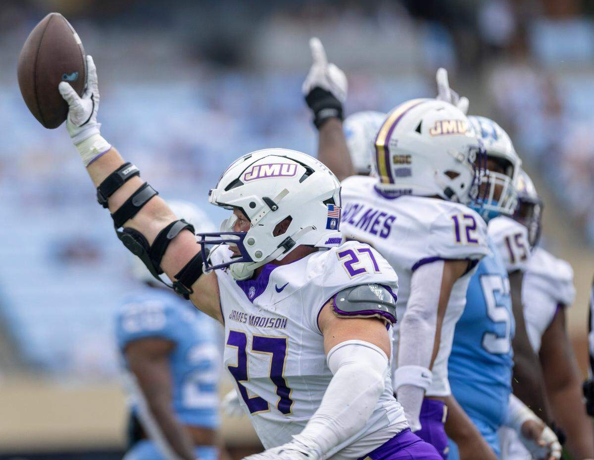 James Madison linebacker Jacob Dobbs (27) reacts after recovering a fumble by North Carolina’s Christian Hamilton (7) in the first quarter on Saturday, September 21, 2024 at Kenan Stadium in Chapel Hill, N.C.