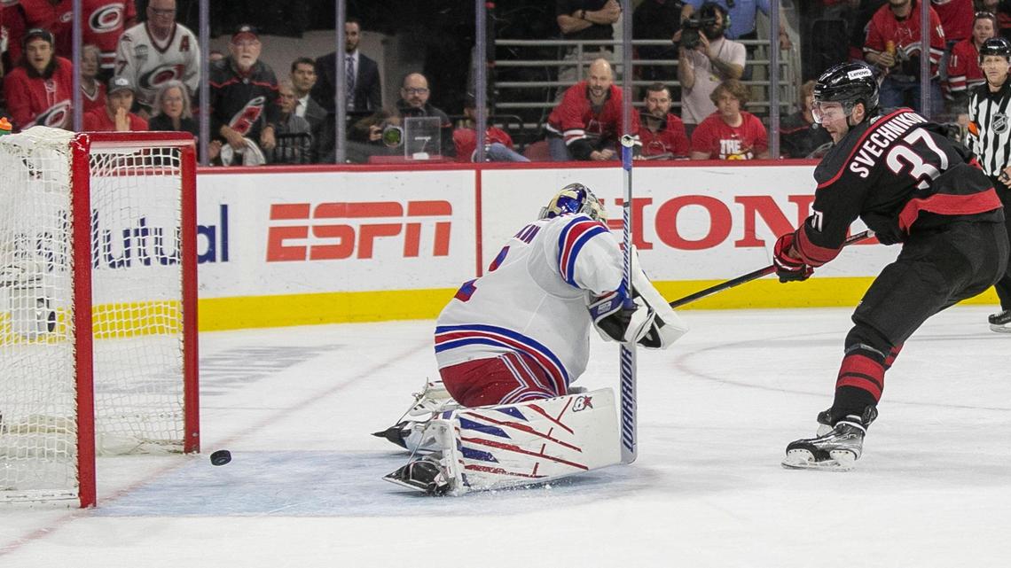 Carolina Hurricanes’ Andrei Svechnikov (37) scores on New York Rangers’ goalie Igor Shesterkin (31) to secure a 3-1 victory on Thursday, May 26, 2022 during game five of the Stanley Cup second round at PNC Arena in Raleigh, N.C.