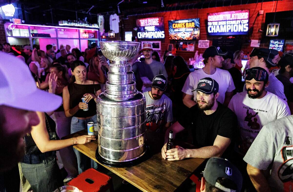 The Stanley Cup makes an appearance at Teets bar in Raleigh's Glenwood South district on Monday, June 15, 2026, as Carolina Hurricanes fans celebrated with the team’s players and staff following the Hurricanes’ Stanley Cup final 4-2 victory over the Vegas Golden Knights the evening prior.