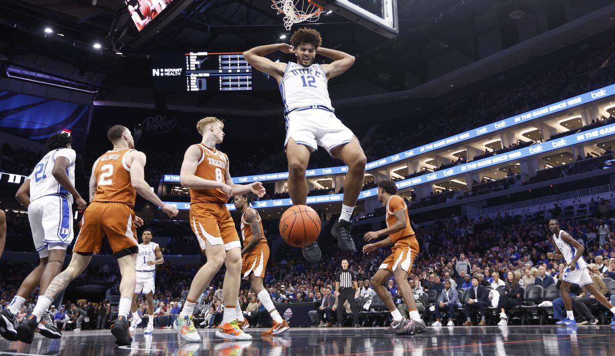 Duke’s Cameron Boozer (12) slams in two in the second half of Duke’s 75-60 victory over Texas in the Dick Vitale Invitational at the Spectrum Center in Charlotte, N.C., Tuesday, Nov. 4, 2025.