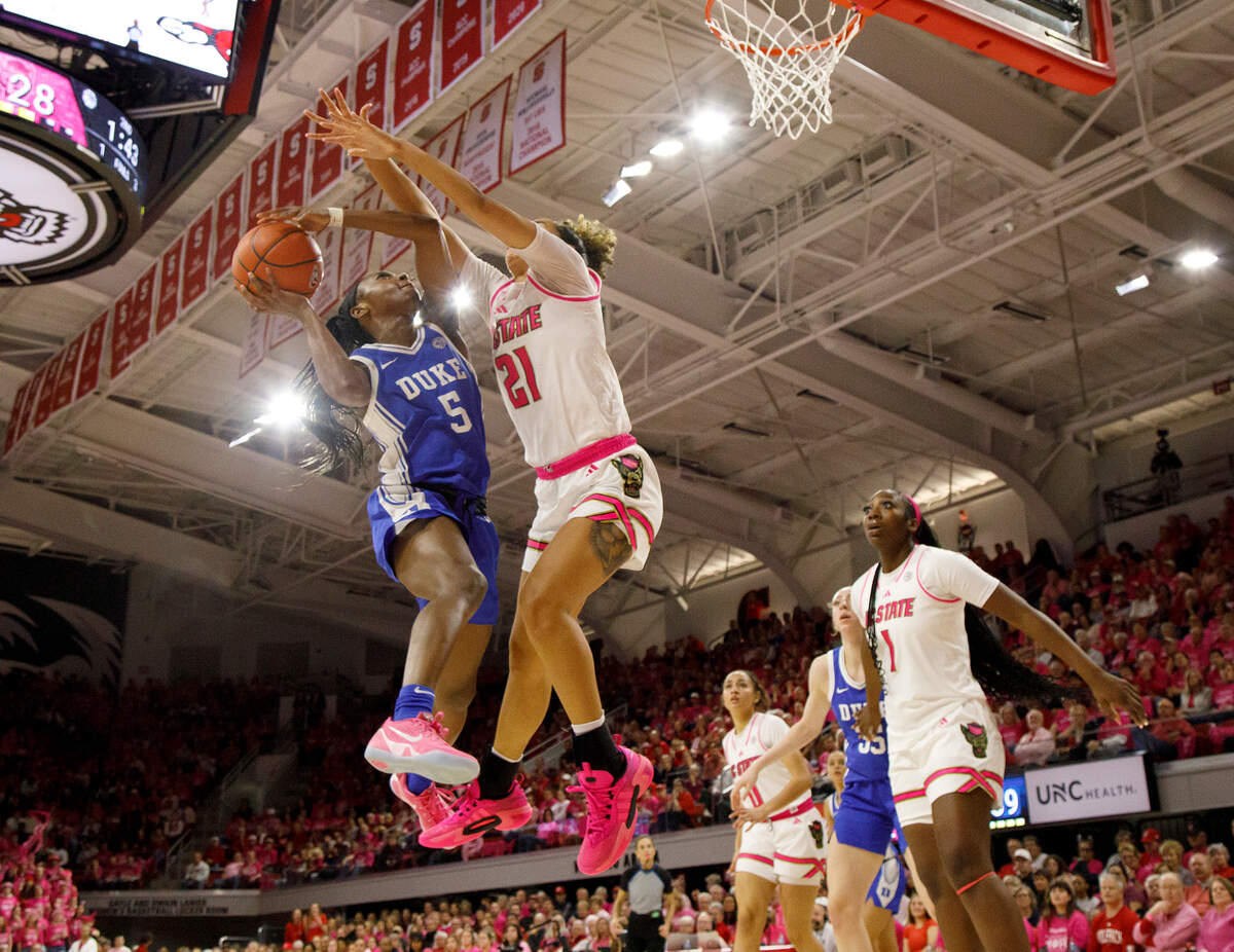 Duke’s Oluchi Okananwa drives to the basket against N.C. State’s Madison Hayes during the first half of the Blue Devils’ 89-83 loss in the Play4Kay Game on Monday, Feb. 3, 2025, at Reynolds Coliseum in Raleigh, N.C.