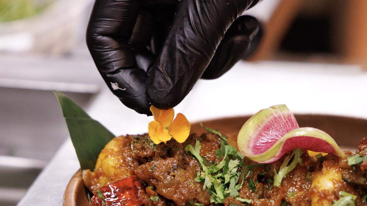 Executive Chef Vinod Kumar prepares Imli Shrimp at Barsa on Thursday, Sept. 25, 2025, in Durham, N.C. Barsa is one of a few dozen Triangle restaurants open on Christmas Day.