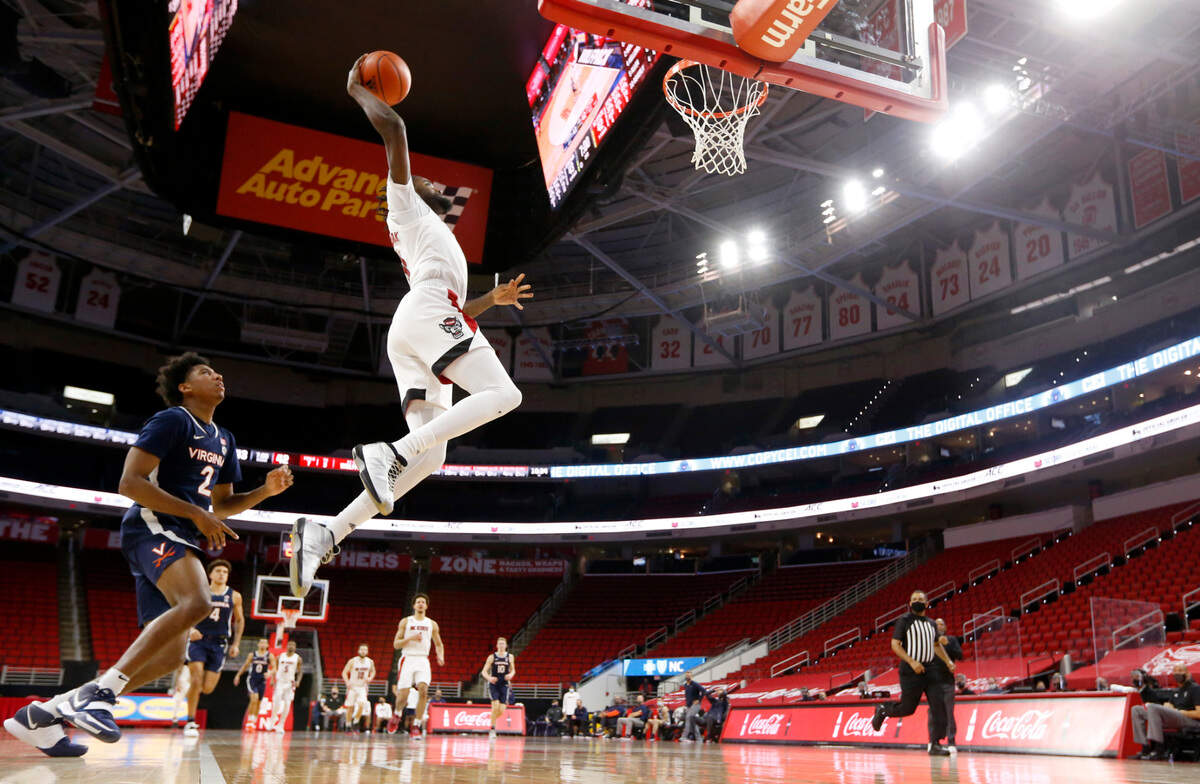N.C. State’s D.J. Funderburk (0) heads in to slam in two during Virginia’s 64-57 victory over N.C. State at PNC Arena in Raleigh, N.C., Wednesday, February 3, 2021.