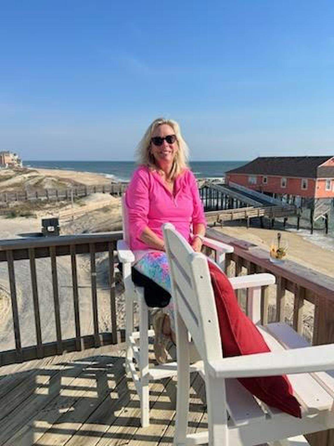 Hilary Graf on the deck of her beach house in Rodanthe, where she plays a shofar and lion’s roar recording to ward off the encroaching waves.