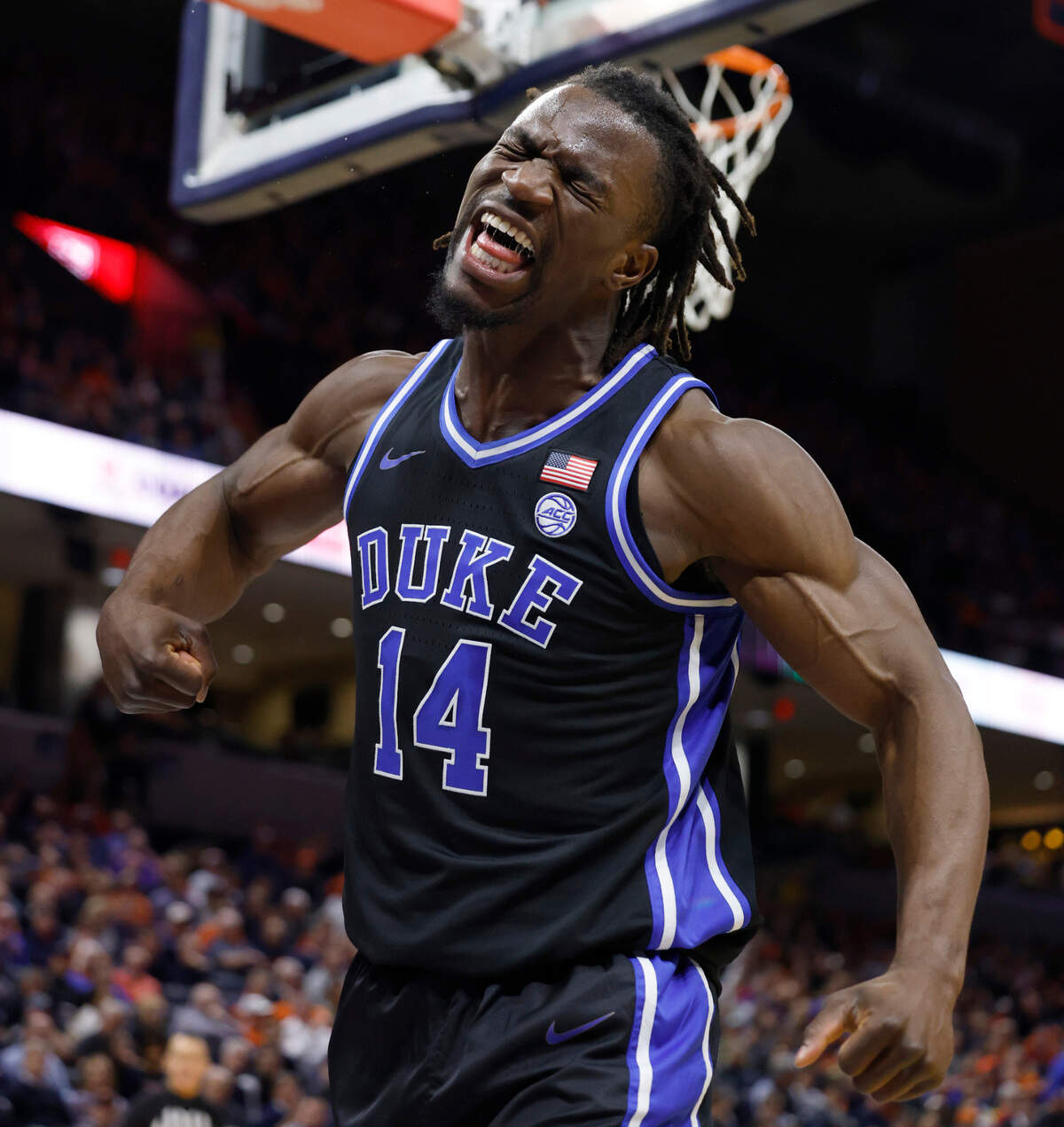 Duke’s Sion James (14) celebrates after making the basket while being fouled during the first half of Duke’s game against Virginia at John Paul Jones Arena in Charlottesville, Va., Monday, Feb. 17, 2025.