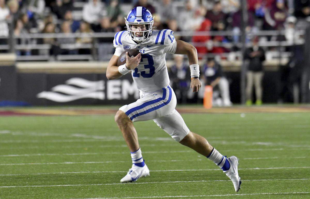 Duke quarterback Leonard Riley runs with the ball during the first half of the team’s NCAA college football game against Boston College on Friday, Nov. 4, 2022 in Boston. (AP Photo/Mark Stockwell)