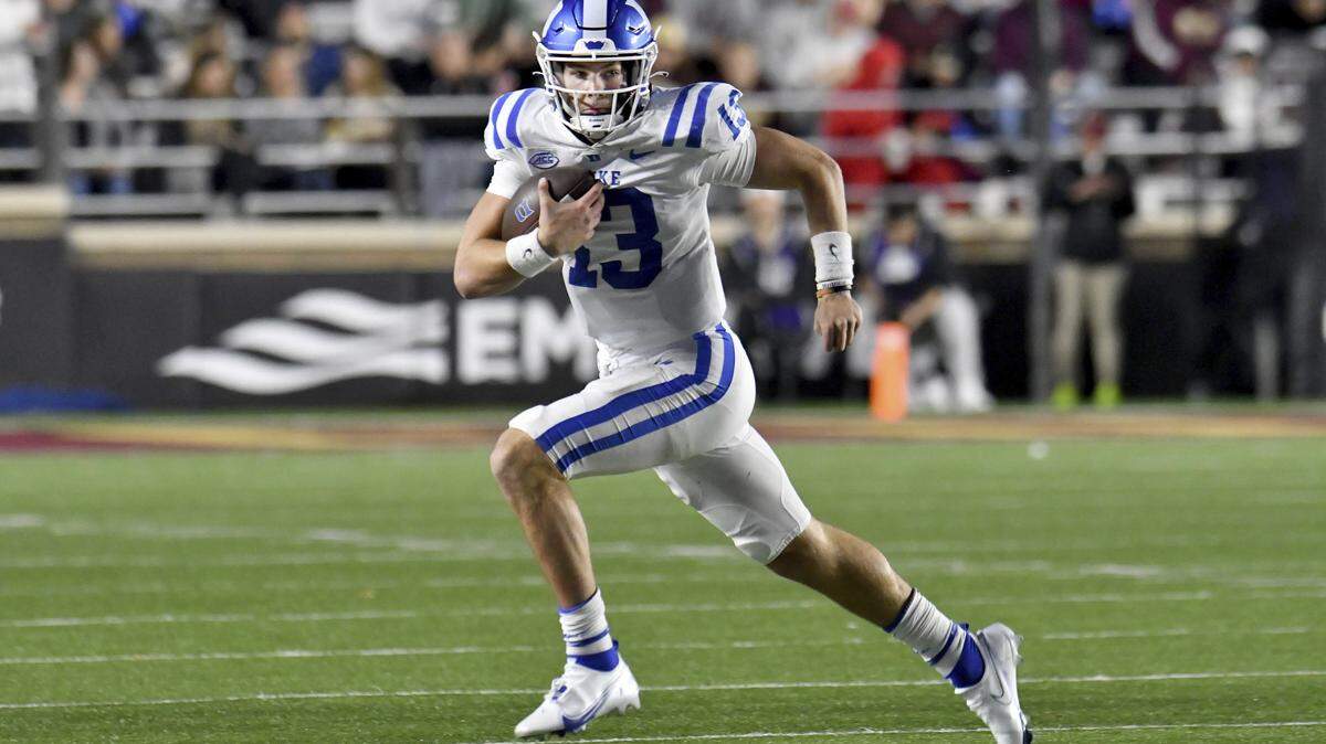 Duke quarterback Leonard Riley runs with the ball during the first half of the team’s NCAA college football game against Boston College on Friday, Nov. 4, 2022 in Boston. (AP Photo/Mark Stockwell)