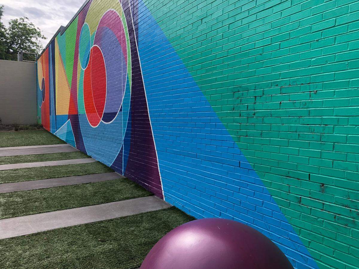 The Color Block Corner brightens 102 S Blount St with brilliant colors.