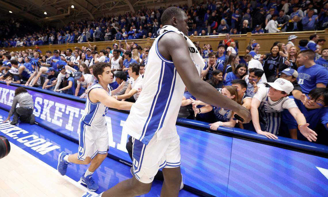 Duke’s Khaman Maluach (9) and Spencer Hubbard (55) greet the Cameron Crazies after the Blue Devils’ 103-47 victory over Arizona State in the Brotherhood Run Charity Game at Cameron Indoor Stadium in Durham, N.C., Sunday, Oct. 27, 2024.
