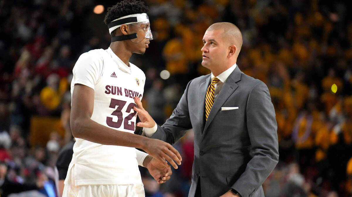 Arizona State assistant coach Joel Justus talks with Alonzo Gaffney during a game against Arizona, Monday, Feb. 27, 2022, in Tempe, Ariz.