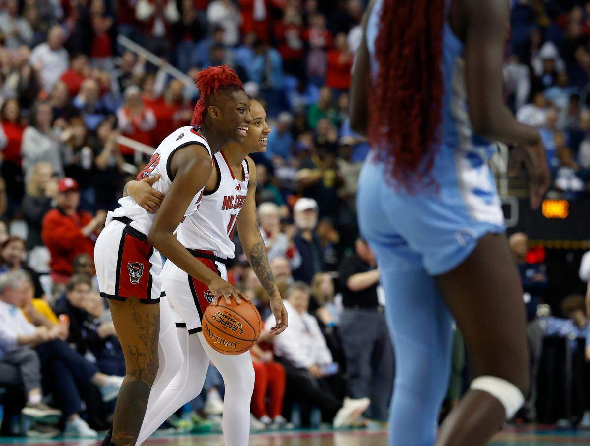N.C. State’s Saniya Rivers and Aziaha James embrace as time runs out at the conclusion of the Wolfpack’s 66-55 win over North Carolina in the ACC Tournament semifinals on Saturday, March 8, 2025, at First Horizon Coliseum in Greensboro, N.C.