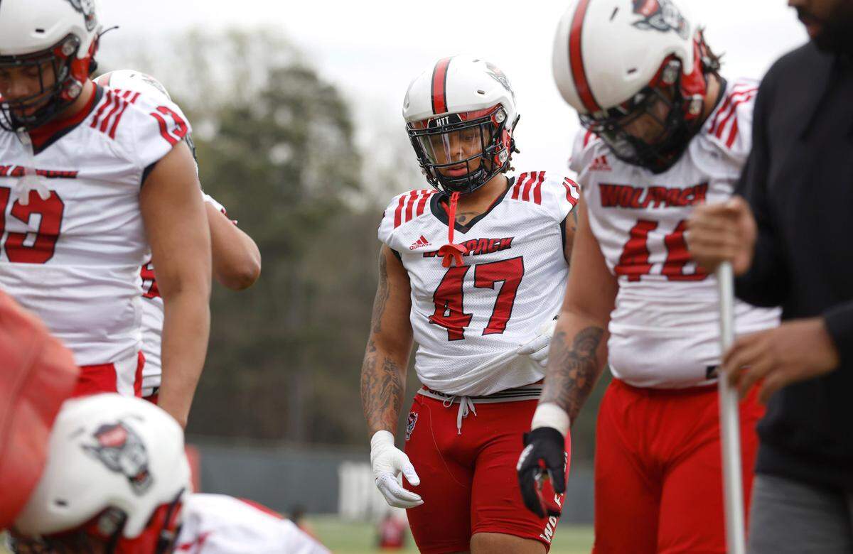 N.C. State defensive end Jykeveous ‘Red’ Hibbler (47) watches as a drill is done during the Wolfpack’s first spring practice in Raleigh, N.C., Wednesday, March 1, 2023.