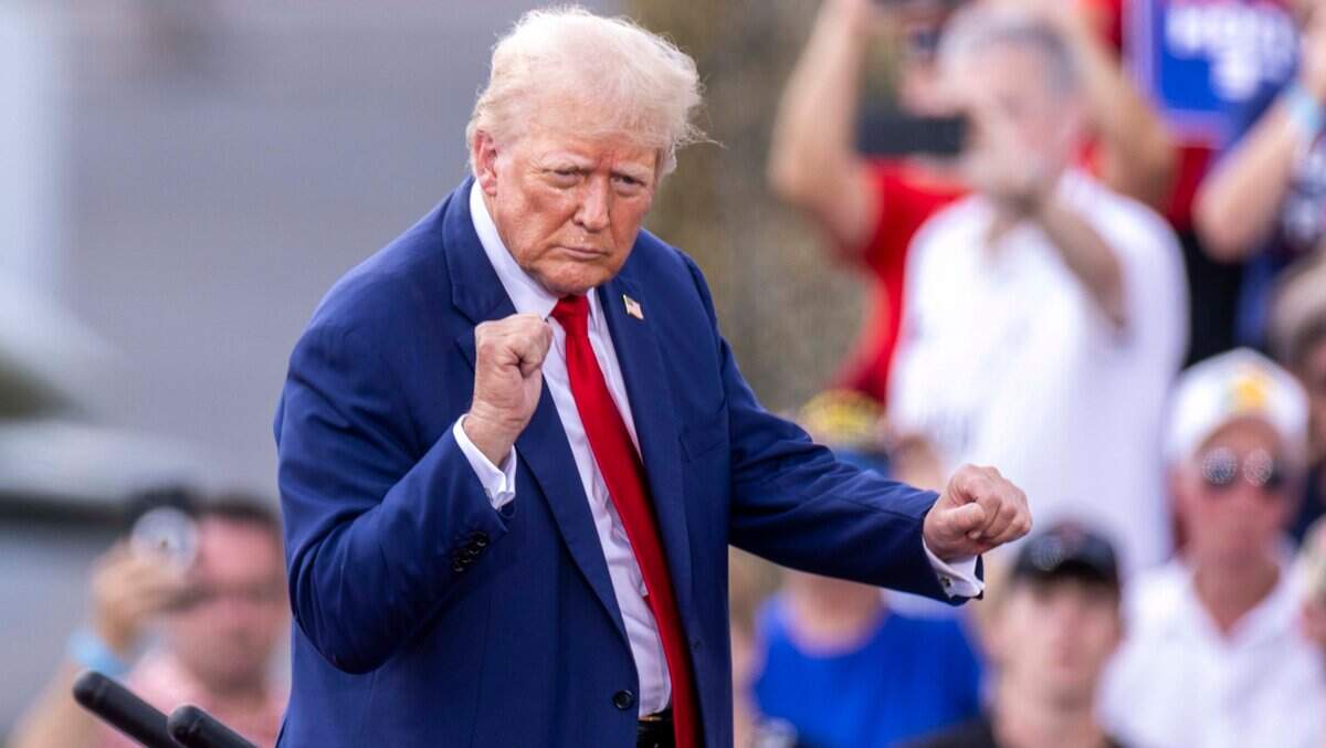 Former President Donald Trump acknowledges supporters during a rally at the North Carolina Aviation Museum & Hall of Fame in Asheboro, NC on Wednesday, Aug. 21, 2024.