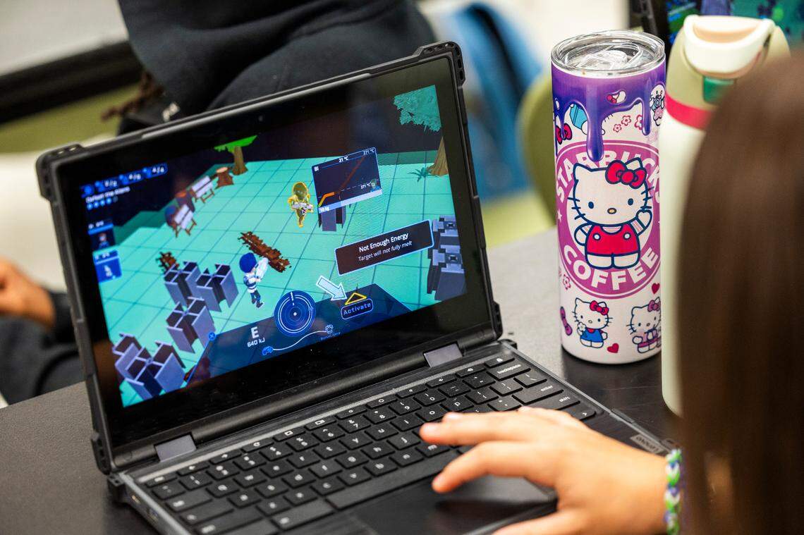 A Wake County middle school student plays the Plasma Games ”SciOps: Global Defense” video game during science class.