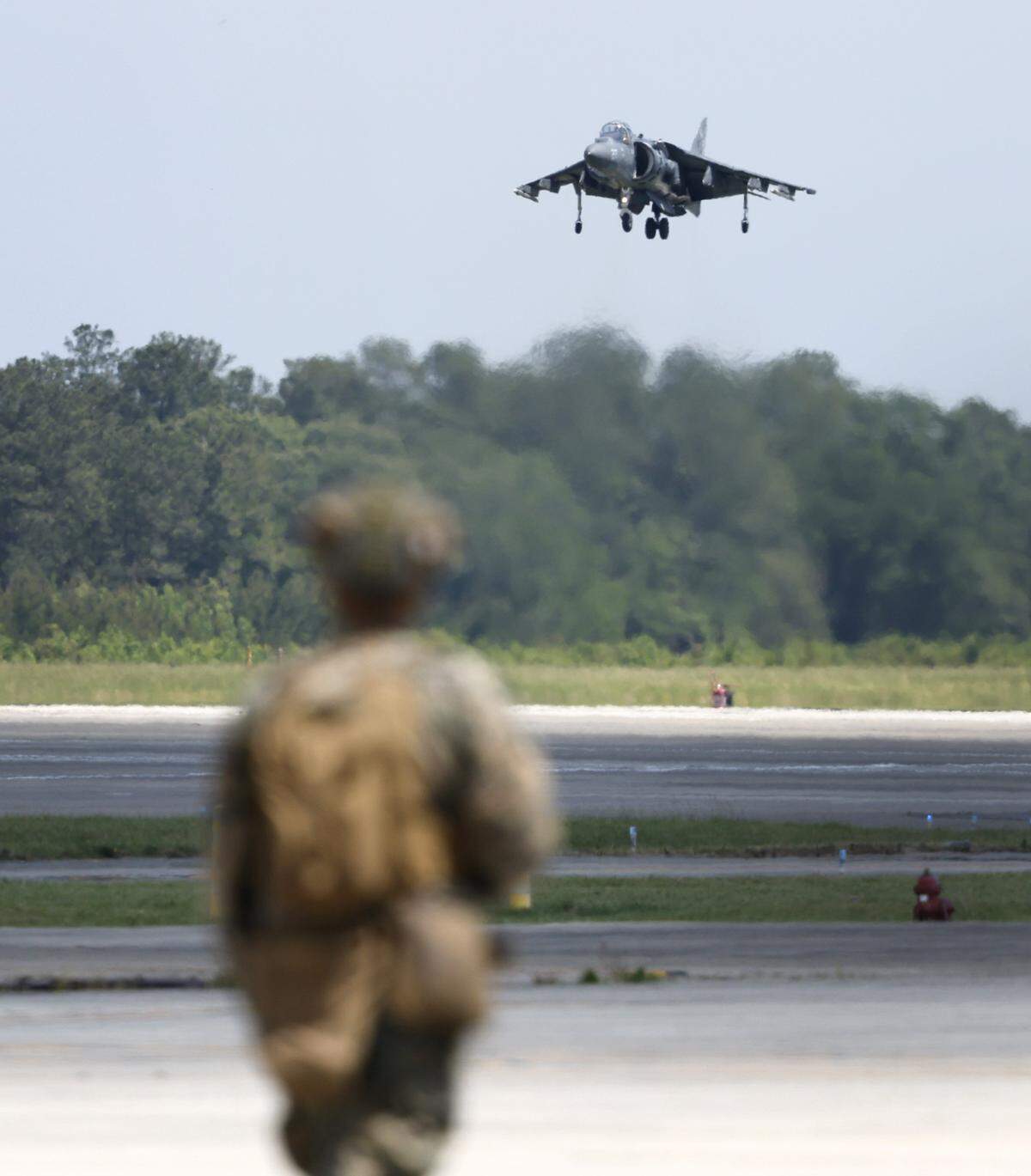 An AV-8B Harrier lands during the MCAS Cherry Point Air Show in Havelock, N.C., Sunday, May 10, 2026. The jet is being retired by the Marine Corps, replaced by the F-35B.