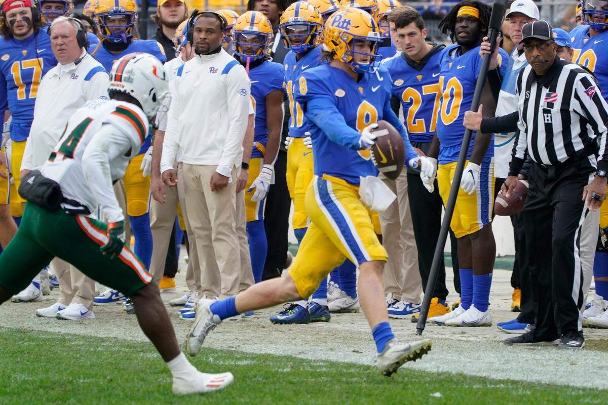 Pittsburgh quarterback Kenny Pickett (8) plays against Miami during an NCAA college football game, Saturday, Oct. 30, 2021, in Pittsburgh.