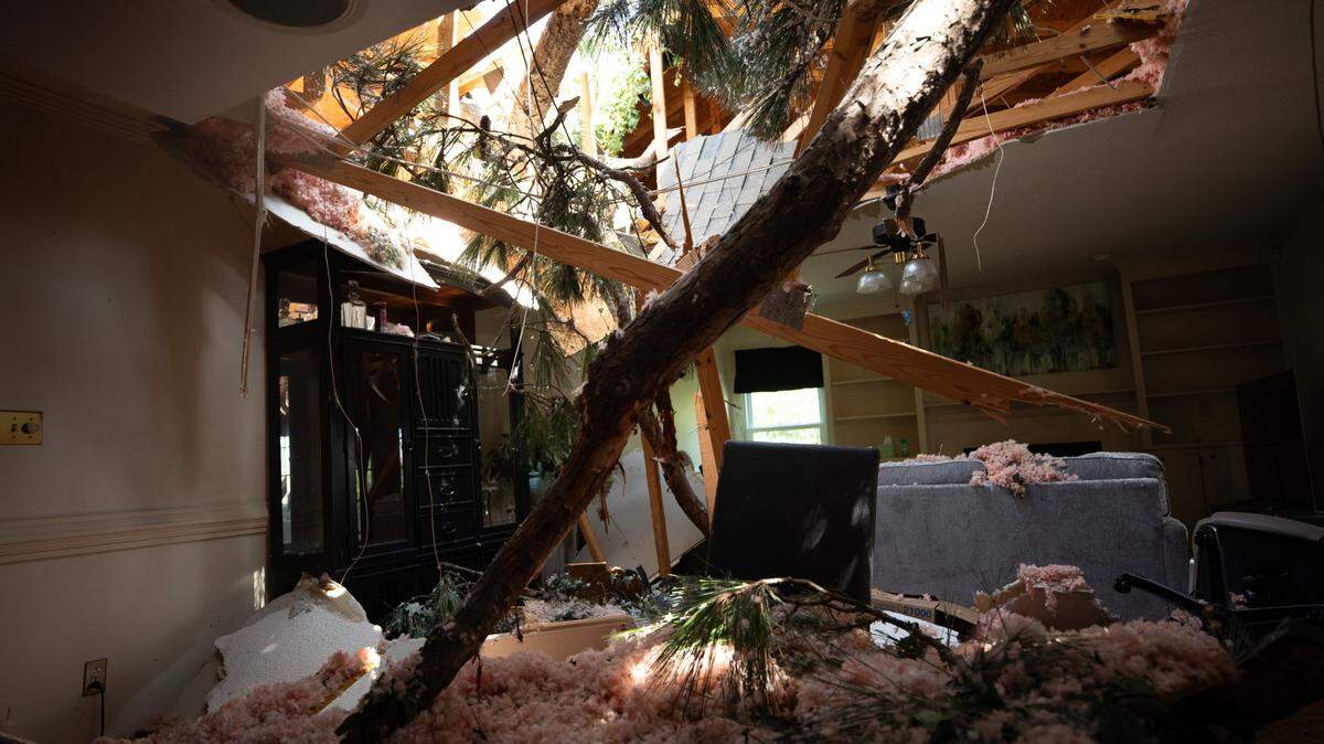 Tornado damage to Joy and John Bashore’s living room in Rocky Mount, N.C. is shown on Thursday, July 20, 2023. A tornado swept through the area with several trees falling on the roof of the Bashore’s residence. Joy said she was inside the house with her dog when the tornado hit, and waited in the hallway until the storm passed. Neither Joy nor her dog were injured.