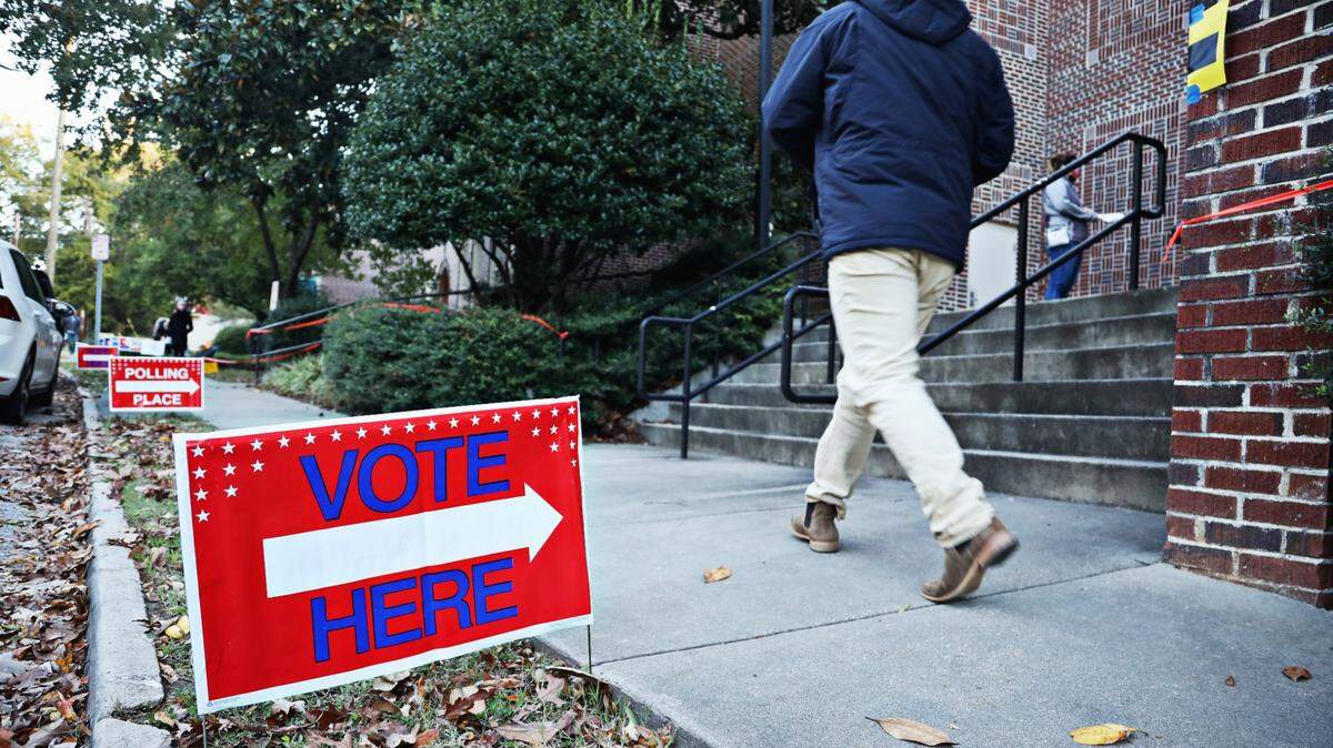 In this file photo a voter heads into a place at Project Enlightenment preschool in Raleigh in 2020.