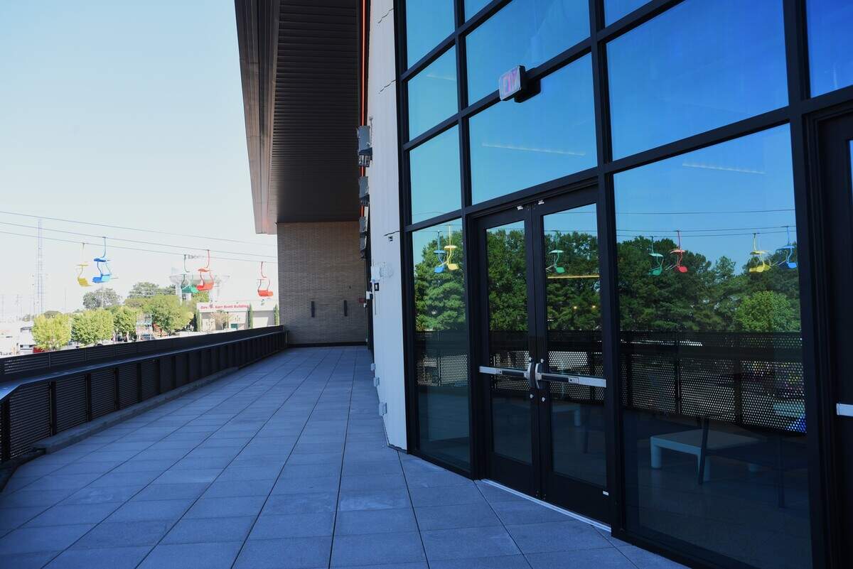 The State Fair Flyer passes right by the balcony of the new food hall at the NC State Fair.