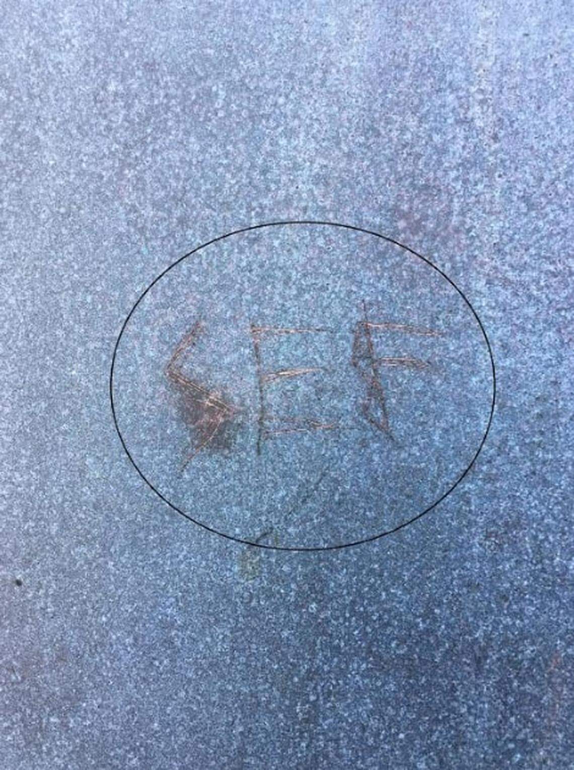 Someone carved what appear to be the letters "SEF" on the bronze door of the Cape Hatteras Lighthouse.