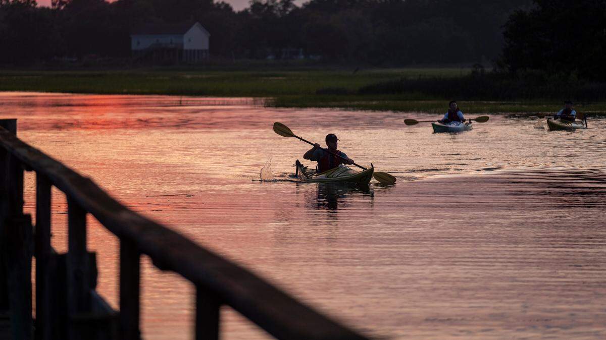 A kayaker glides through a salt marsh tidal creek near Folly Beach, SC. Scientists studying chemicals in salt marshes lost their jobs Feb. 27, 2025 in a purge of federal workers by President Donald Trump.