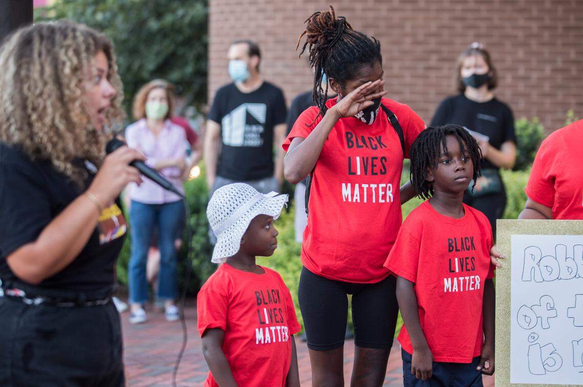 Makeba Hoffler, the mother of 9-year-old Zakarrayya Cornelius, wipes away tears during a #RochelleBoysMatter protest at City Hall in Durham, N.C. on Friday, Sept. 4, 2020. Her son, 9-year-old Zakarrayya Cornelius, right, was one of three children who, according to them, had guns pulled on them by five Durham police officers while they played tag outside of Rochelle Manor Apartments on Aug. 21st.