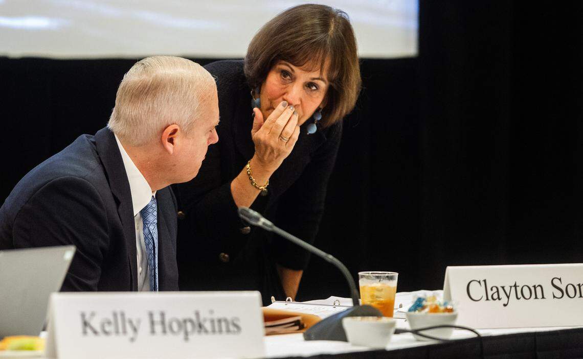 UNC-Chapel Hill Chancellor Carol Folt, right, confers with Vice Chancellor for Public Affairs Clayton Somers Monday, Dec. 3, 2018.