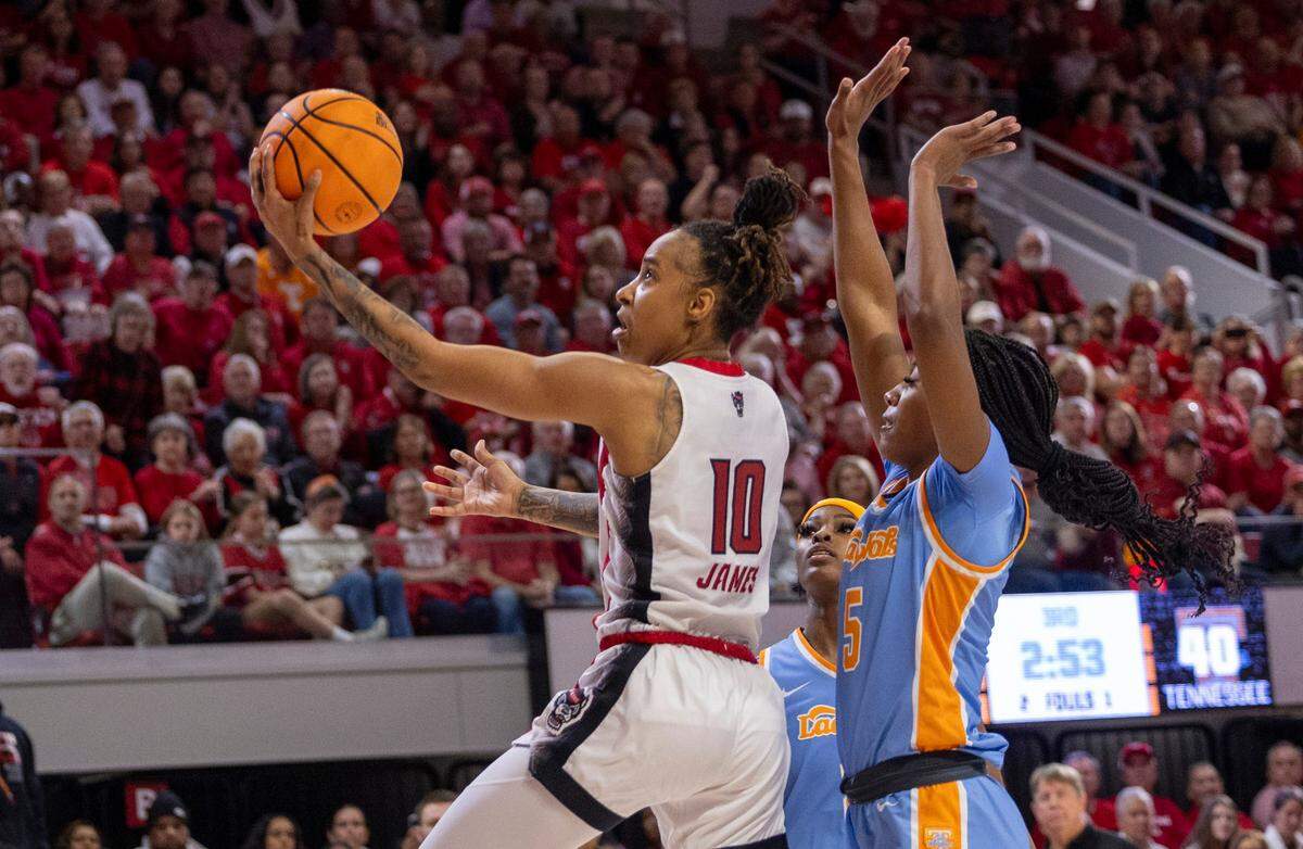 NC State’s Aziaha James (10) shoots as Tennessee’s Kaiya Wynn (5) defends during the second round of the Division I Women’s Basketball Championship at Reynolds Coliseum in Raleigh, on March 25, 2024.
