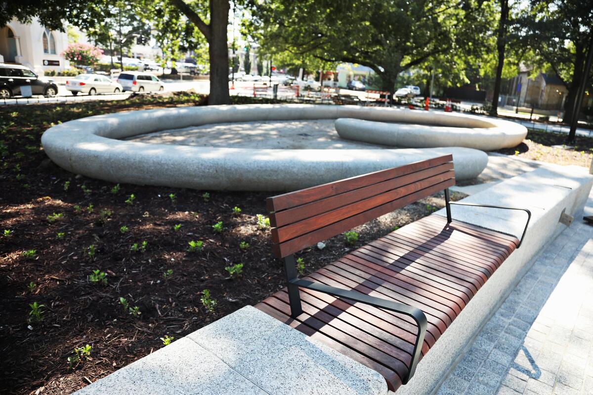 Moore Square Park opens Aug. 2 after a massive renovation, including a curved spiral of granite seating, designed for intimate conversations.